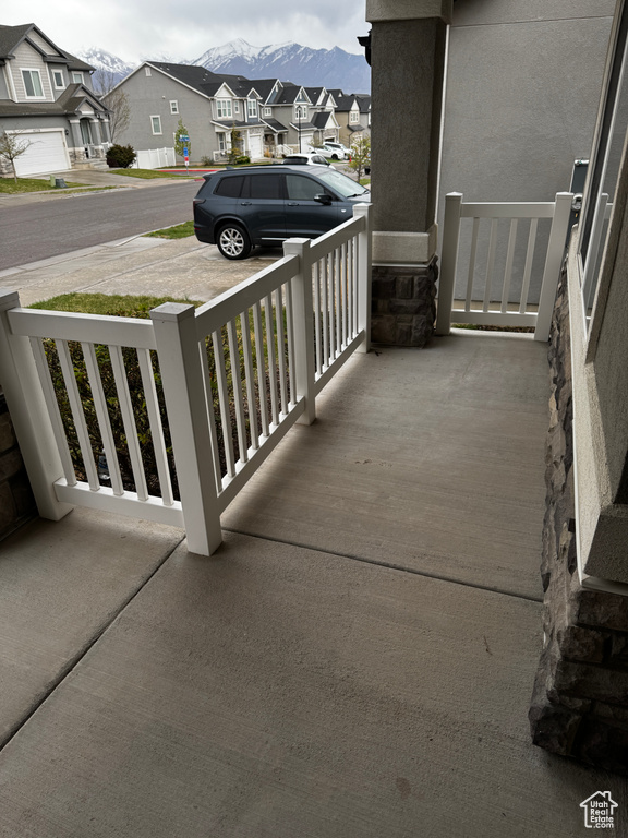 Balcony featuring a residential view and covered porch