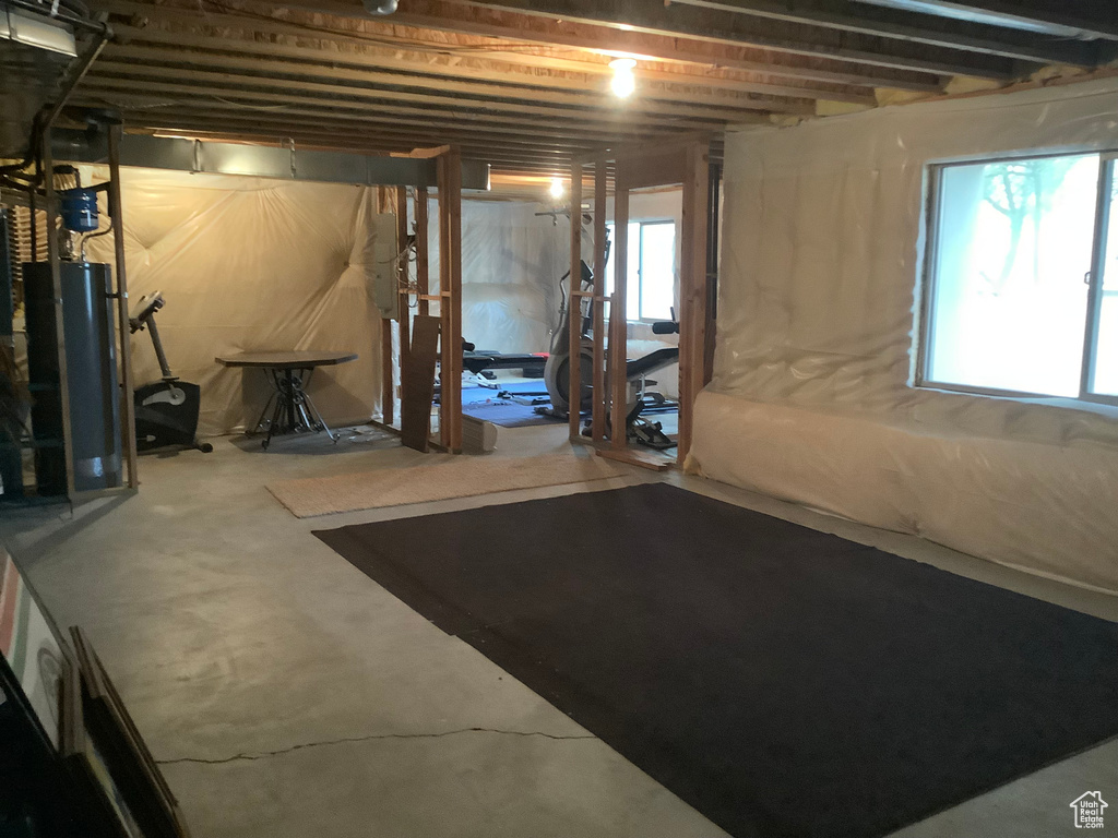 Basement with water heater and plenty of natural light