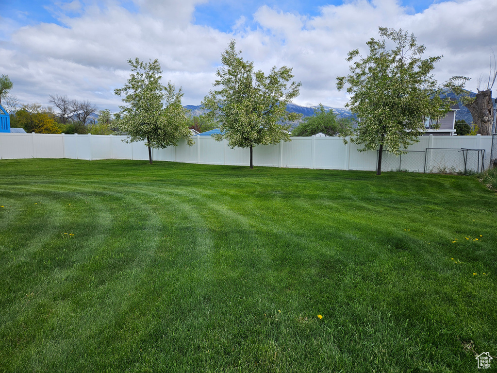 View of yard with fence