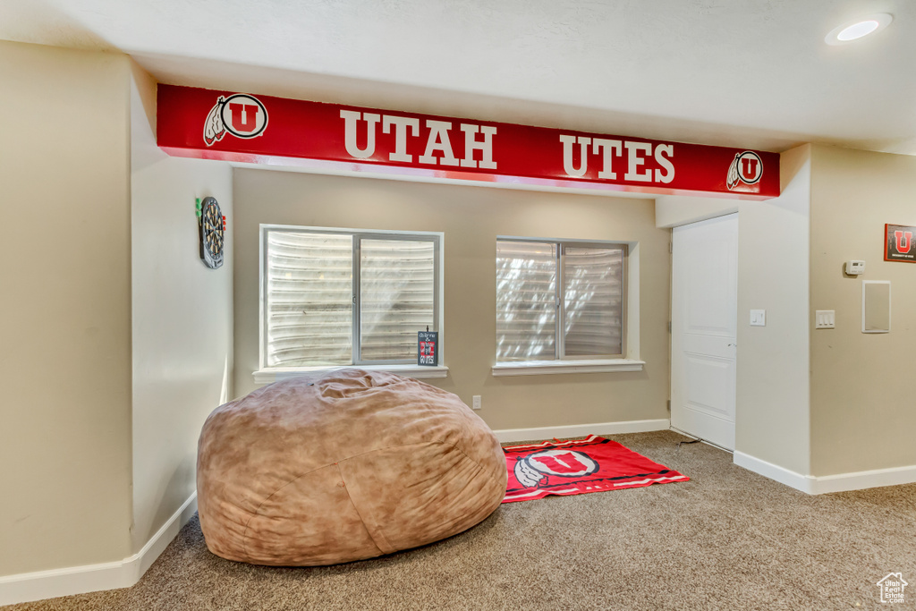 Living area featuring recessed lighting, carpet floors, and baseboards