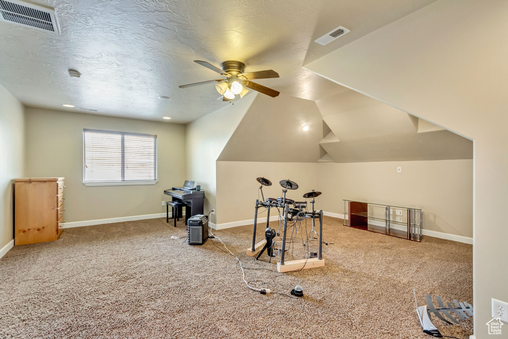 Bonus room with baseboards, a ceiling fan, visible vents, and carpet flooring