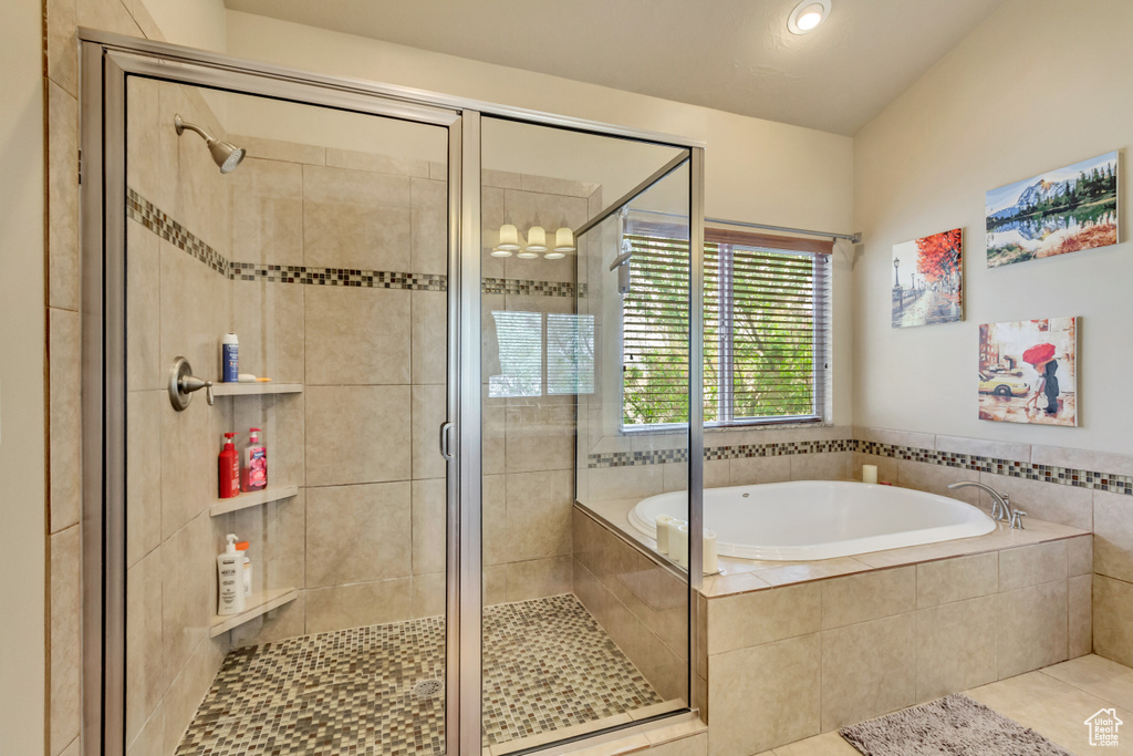 Full bath featuring tile patterned floors, a garden tub, recessed lighting, and a stall shower