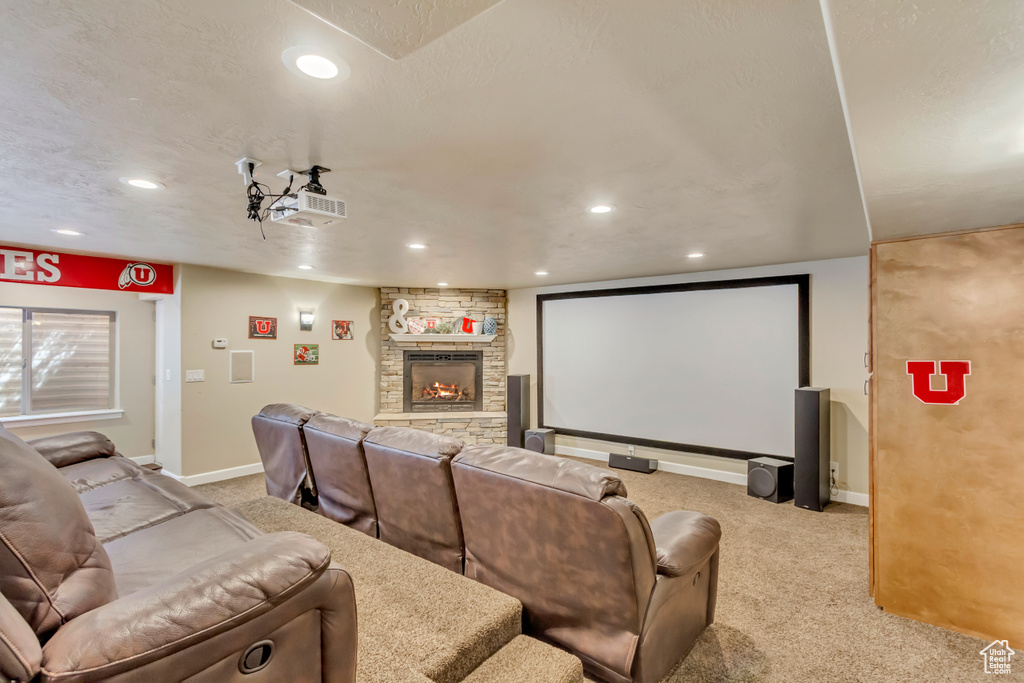 Carpeted cinema with recessed lighting, a fireplace, and baseboards