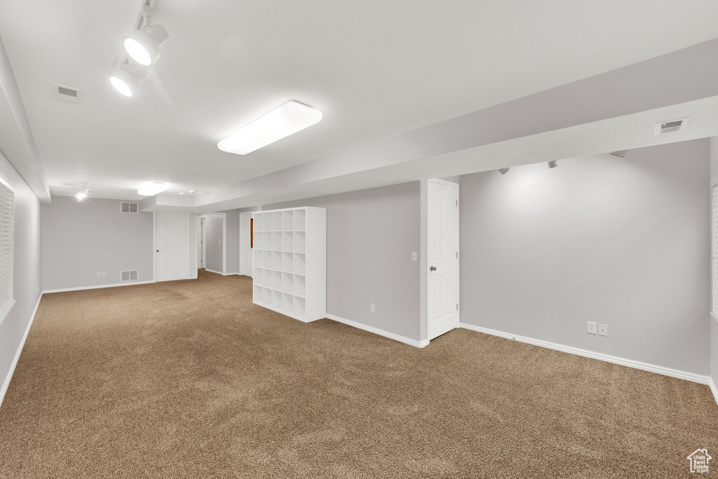 Finished below grade area with carpet and baseboards