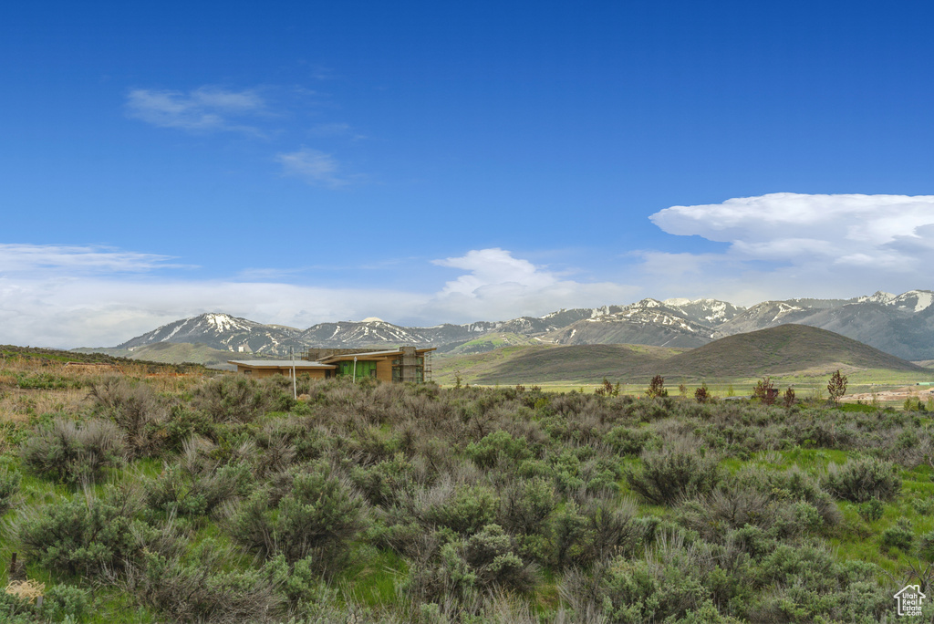 View of mountain backdrop with rural landscape