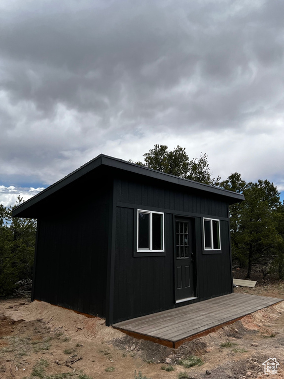 View of outdoor structure with an outbuilding