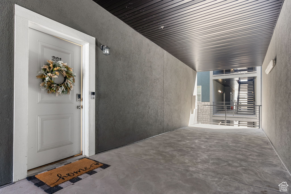 Property entrance with stucco siding