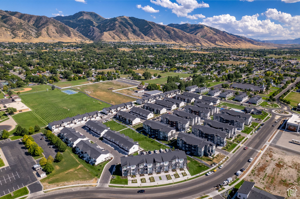 Birds eye view of property with a residential view and a mountain view