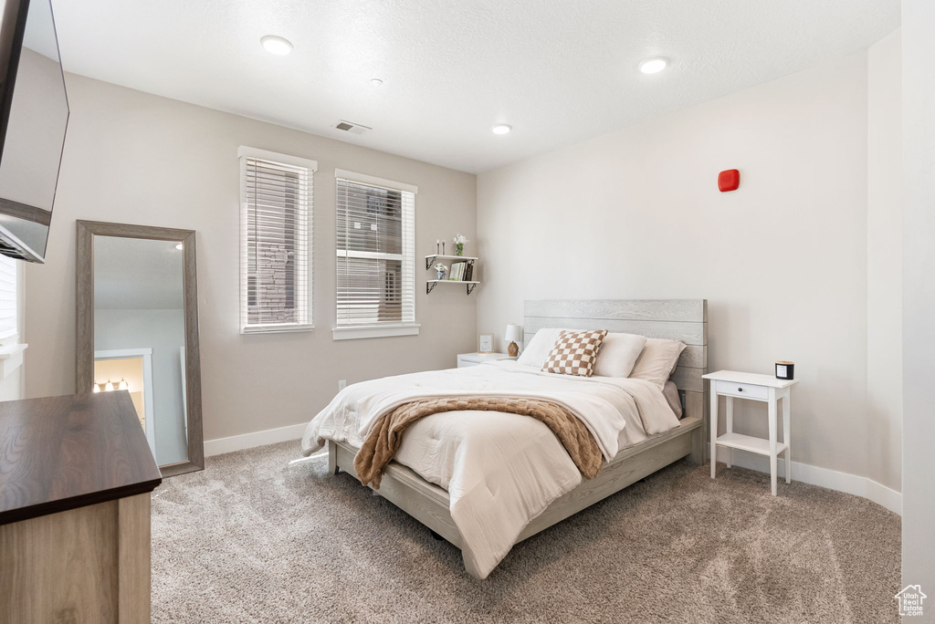Bedroom with recessed lighting, baseboards, visible vents, and carpet