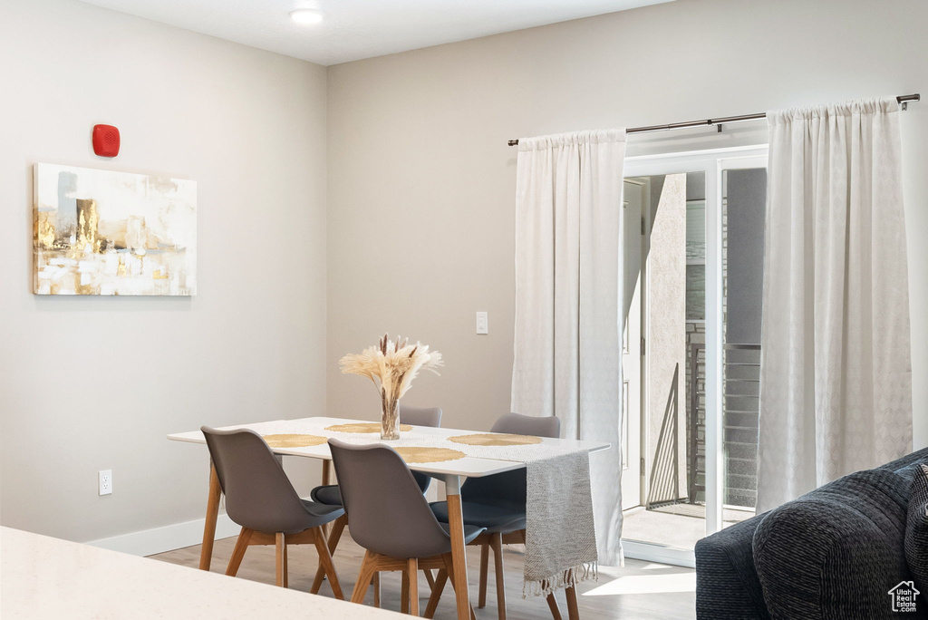 Dining room featuring baseboards and wood finished floors