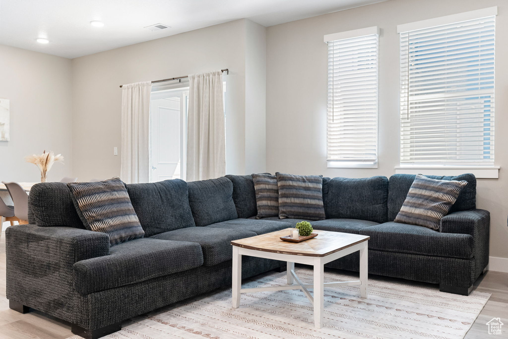 Living room featuring light wood finished floors and visible vents