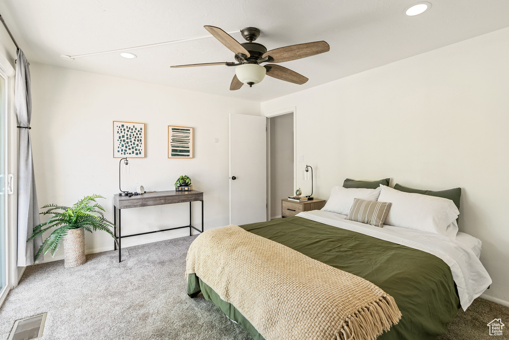 Carpeted bedroom with recessed lighting and ceiling fan