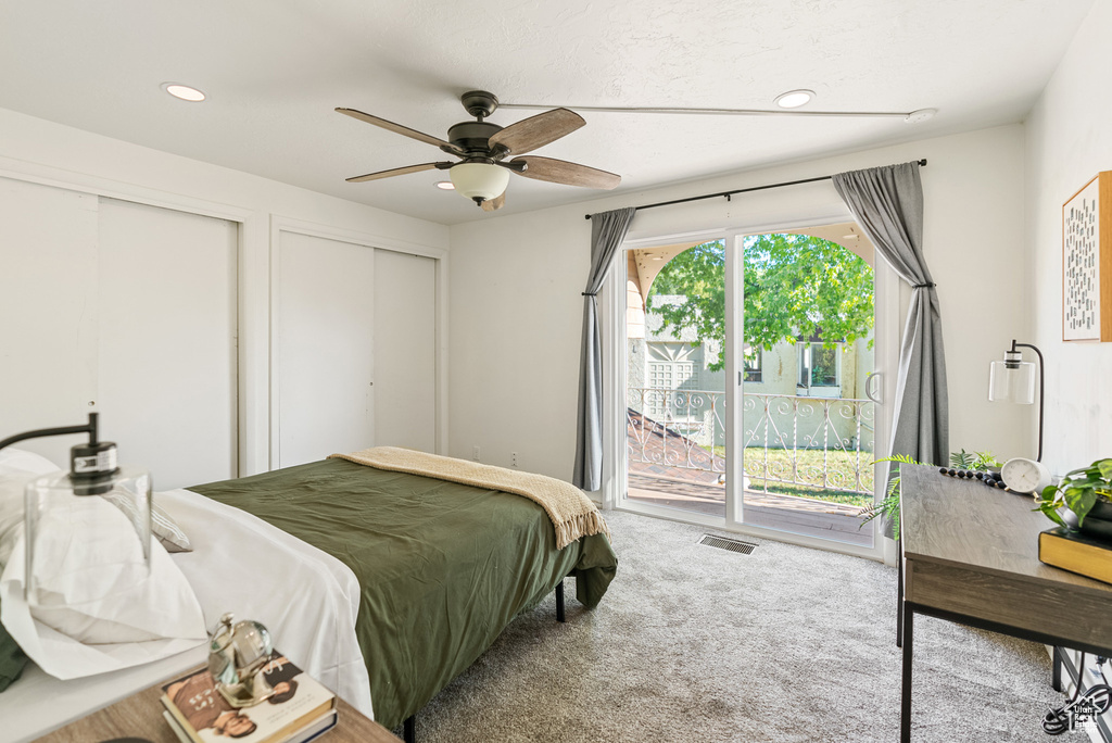 Carpeted bedroom featuring access to outside, multiple closets, ceiling fan, and recessed lighting