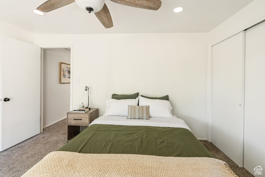 Carpeted bedroom with a closet, a ceiling fan, recessed lighting, and baseboards