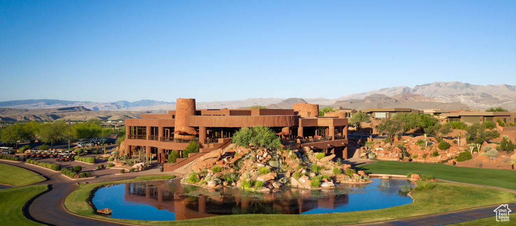 View of community with a water and mountain view