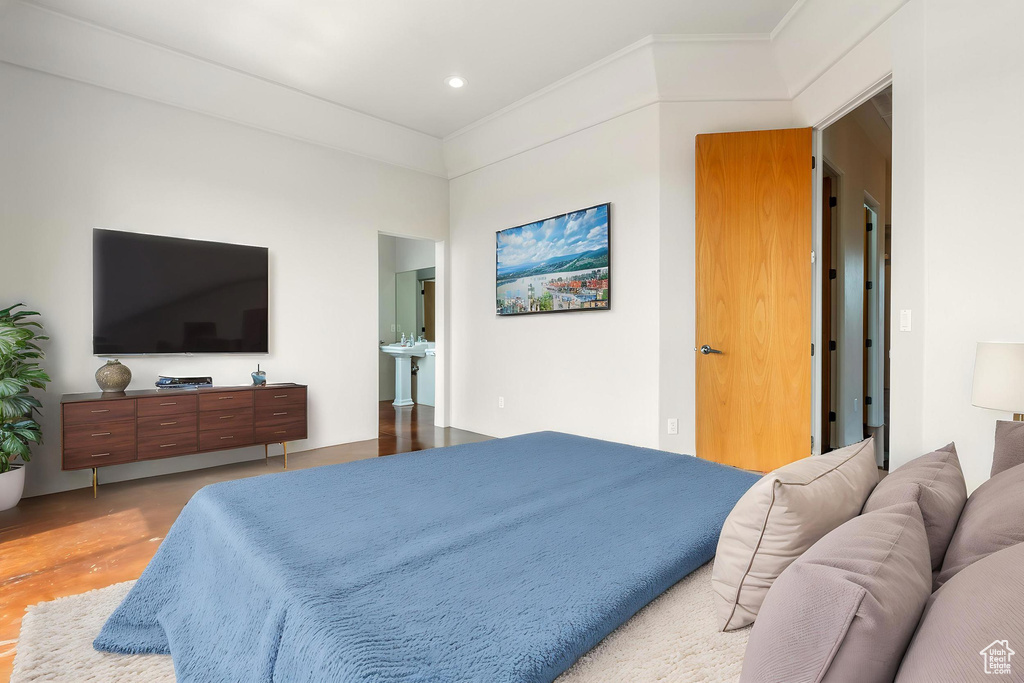 Bedroom with crown molding and recessed lighting