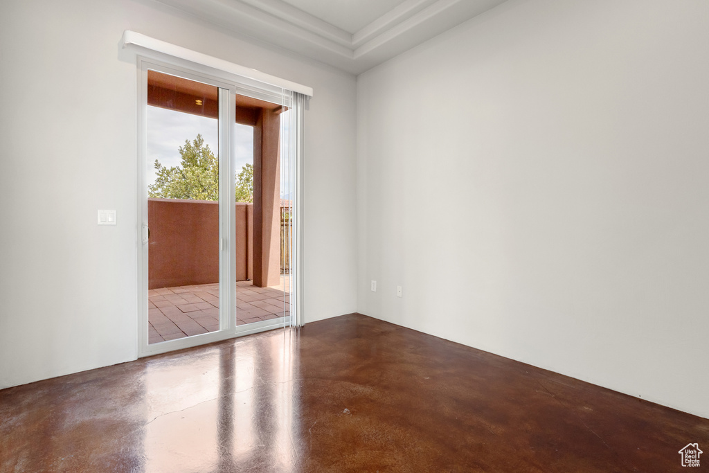 Unfurnished room with concrete flooring