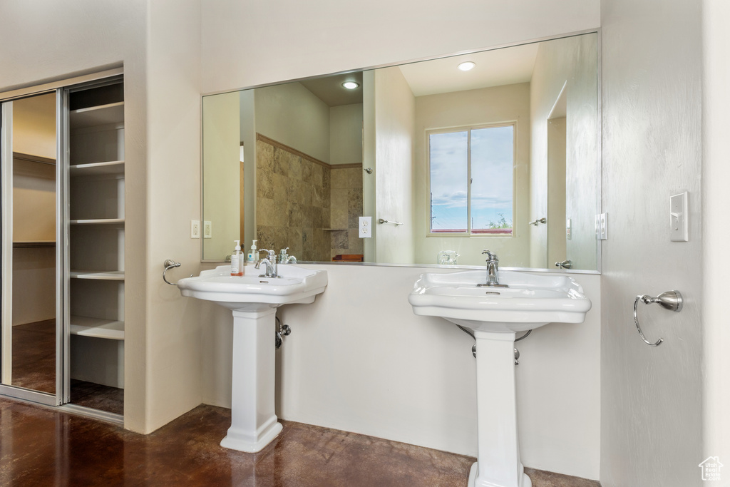 Full bathroom featuring finished concrete floors