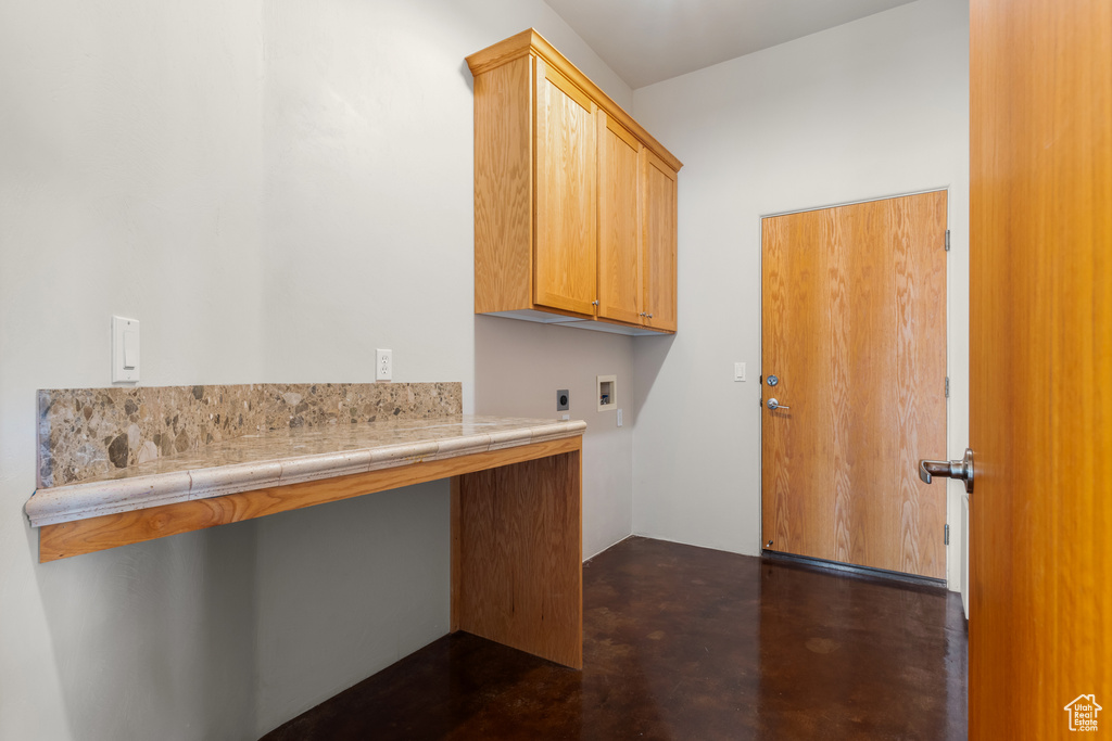 Laundry area with cabinet space, electric dryer hookup, and washer hookup