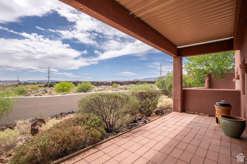 View of patio with a mountain view