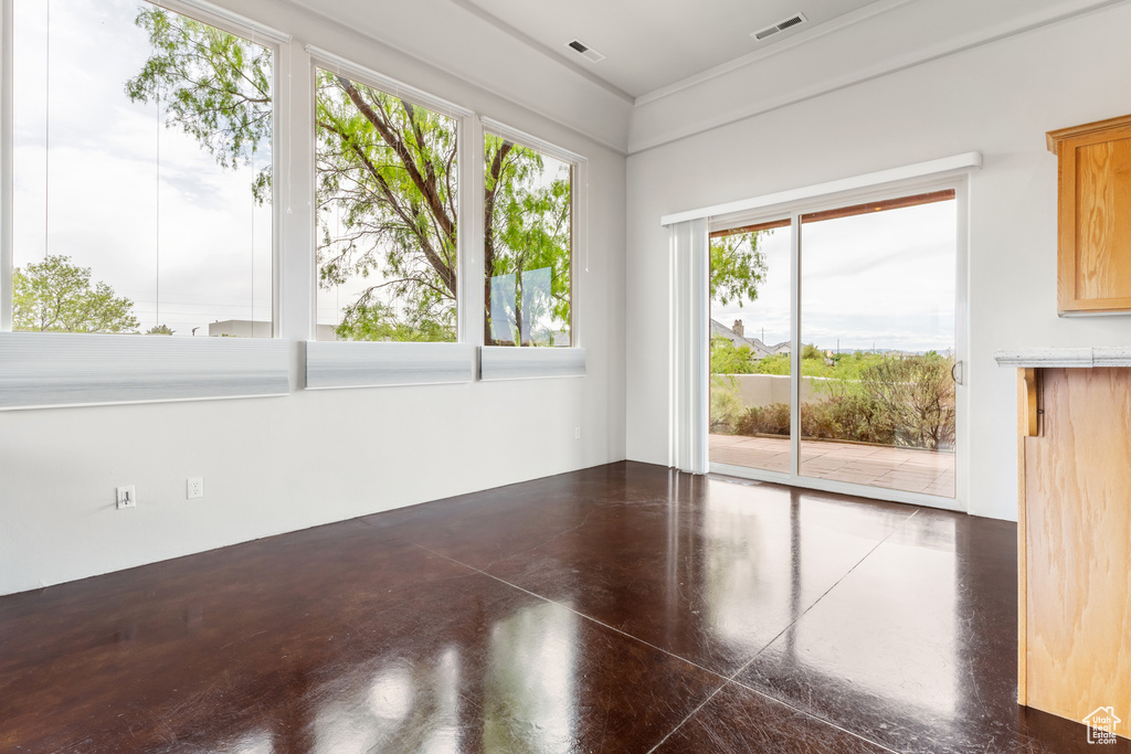 Spare room with concrete flooring and visible vents