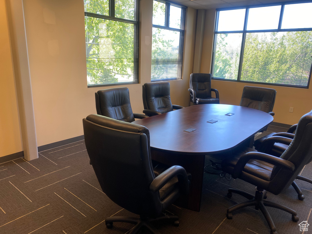 Office area with dark colored carpet