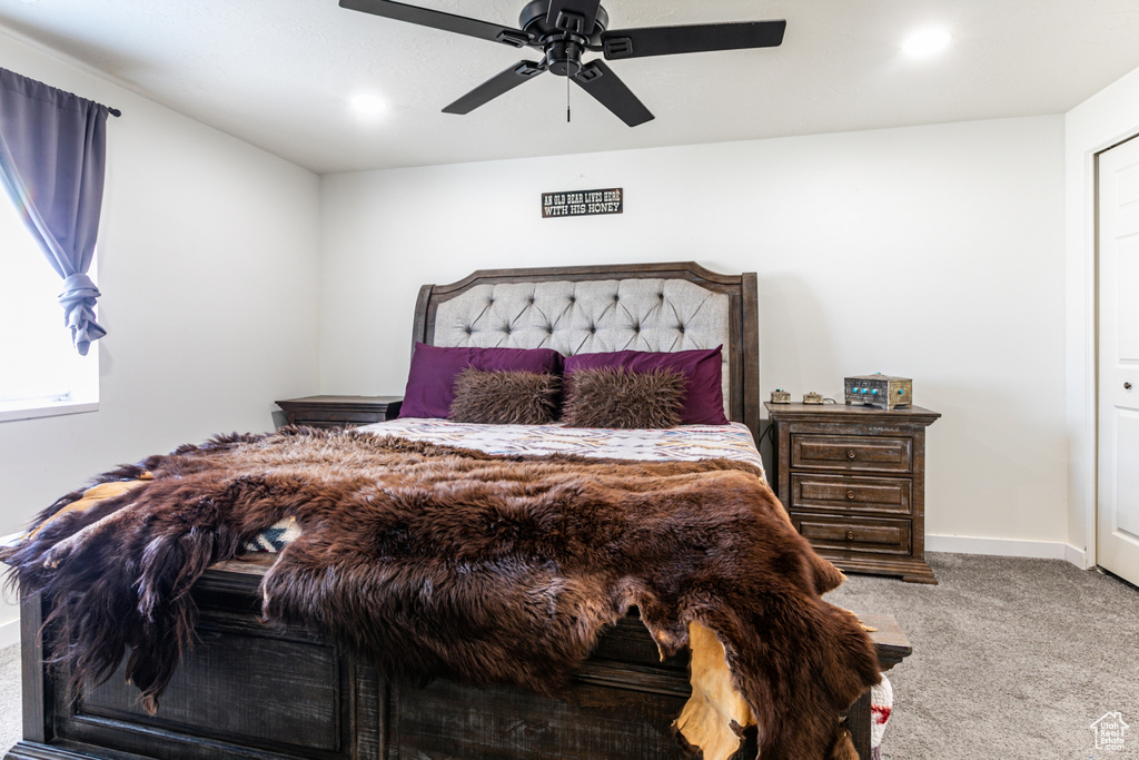 Carpeted bedroom featuring ceiling fan, baseboards, and recessed lighting
