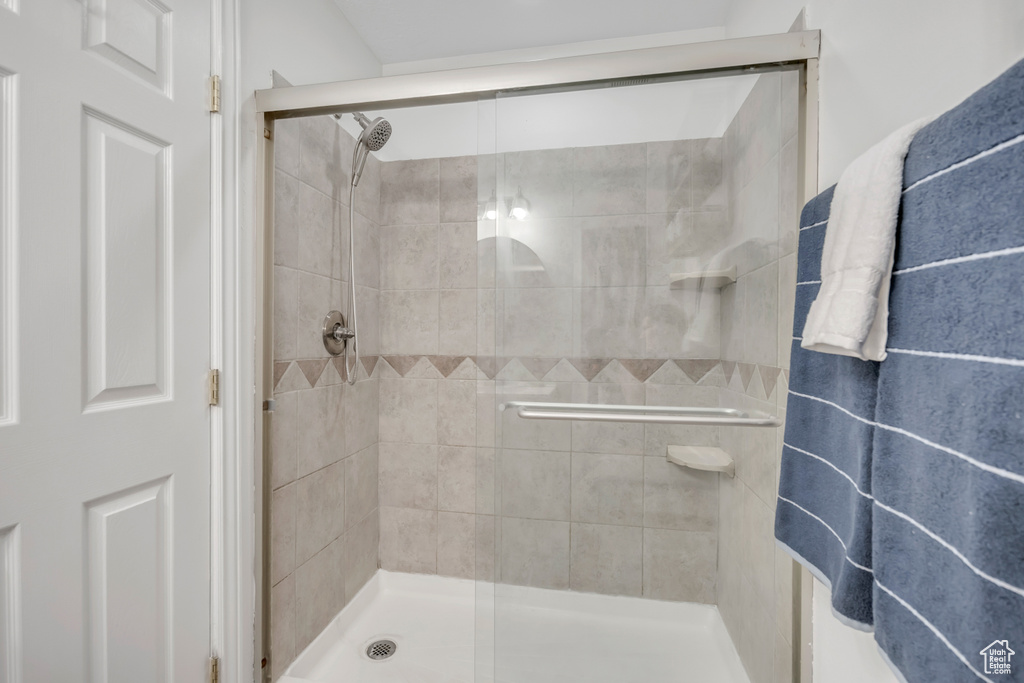 Full bathroom with a shower stall
