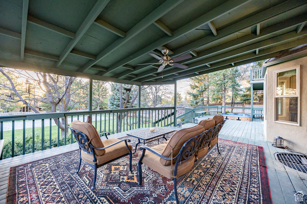 Wooden deck featuring ceiling fan