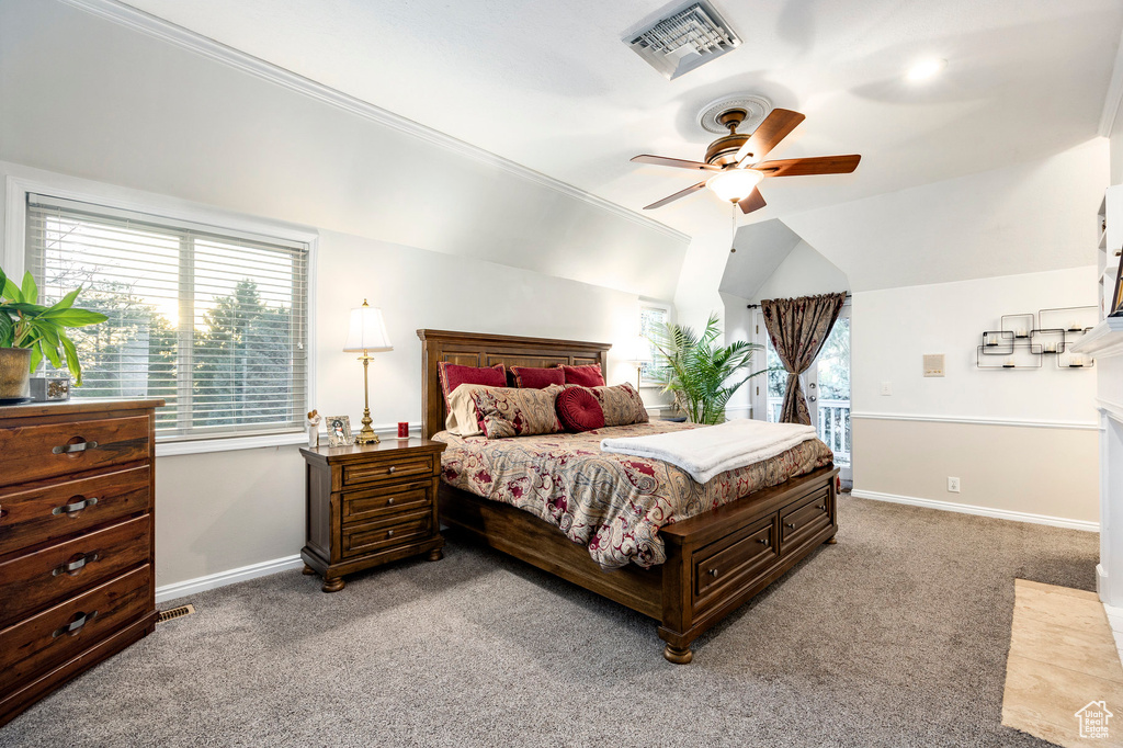 Bedroom with light colored carpet, ornamental molding, visible vents, ceiling fan, and baseboards