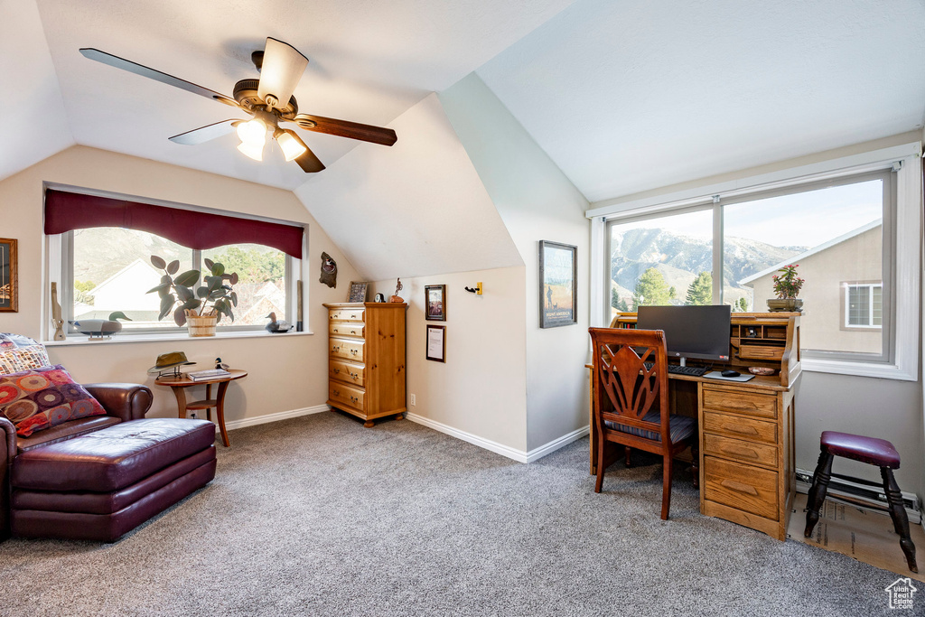 Office space featuring carpet flooring, a ceiling fan, baseboards, baseboard heating, and vaulted ceiling