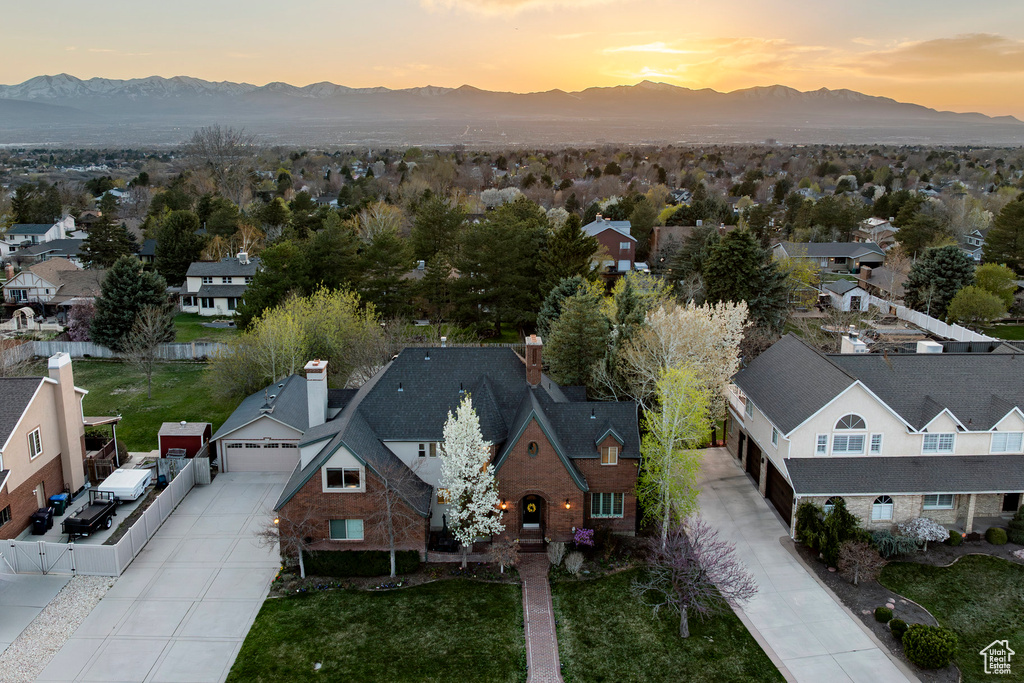 Aerial view at dusk with a residential view and a mountain view