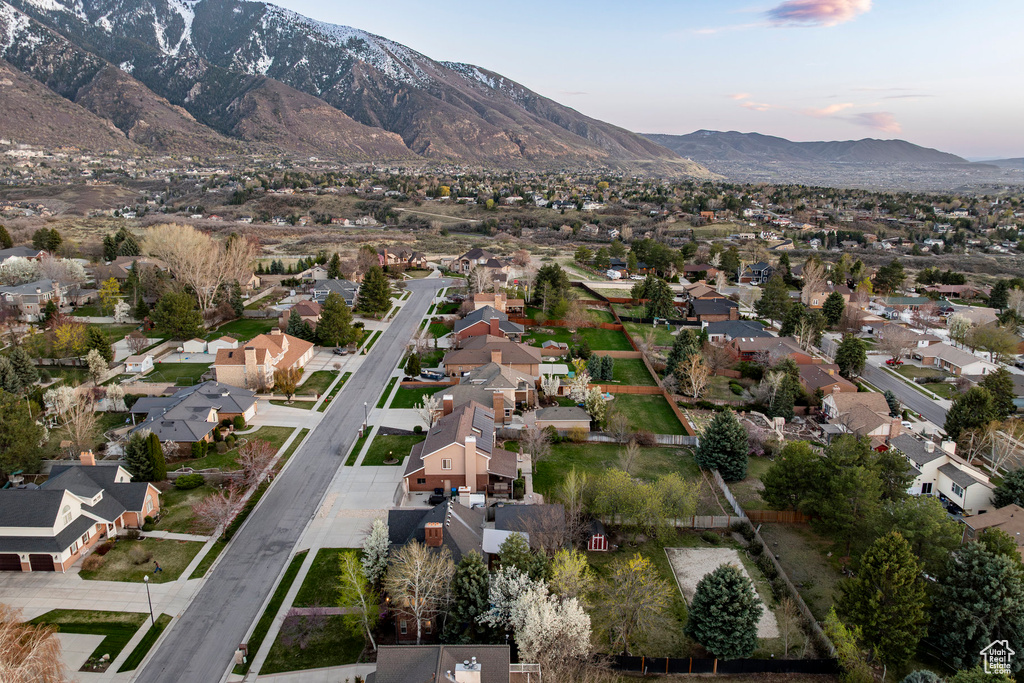 Birds eye view of property with a mountain view and a residential view