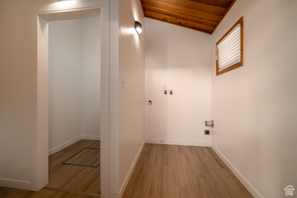 Washroom featuring wooden ceiling, hookup for an electric dryer, wood finished floors, and baseboards