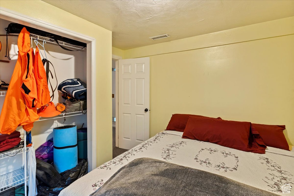 Bedroom with visible vents