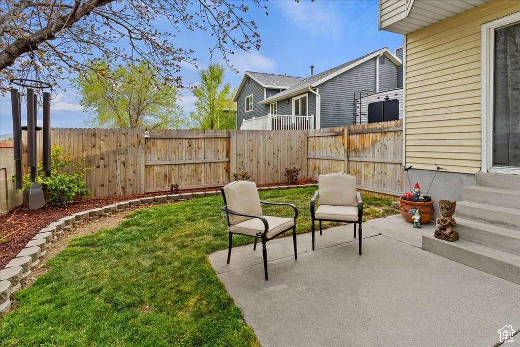 View of yard featuring a fenced backyard, a patio area, and entry steps