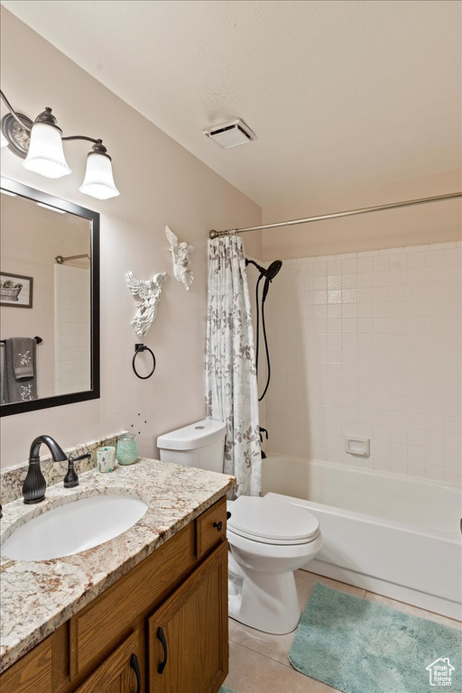Bathroom with vanity, shower / tub combo, toilet, tile patterned flooring, and visible vents