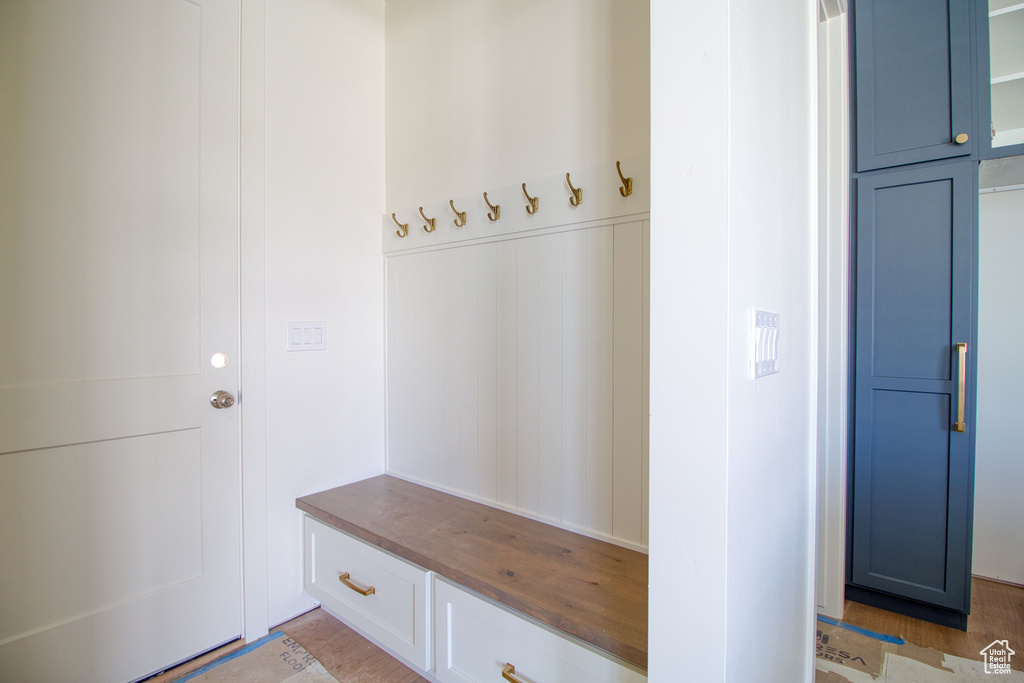 Mudroom with light wood-style flooring