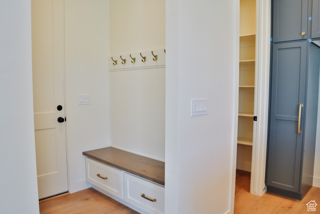Mudroom with light wood finished floors