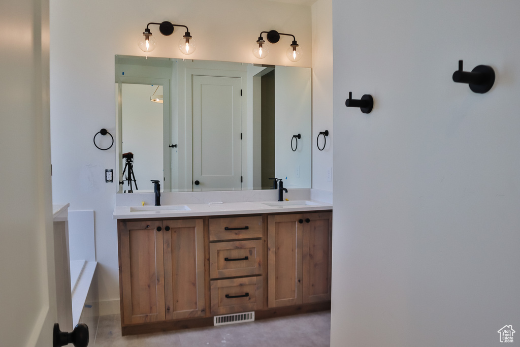 Bathroom featuring double vanity
