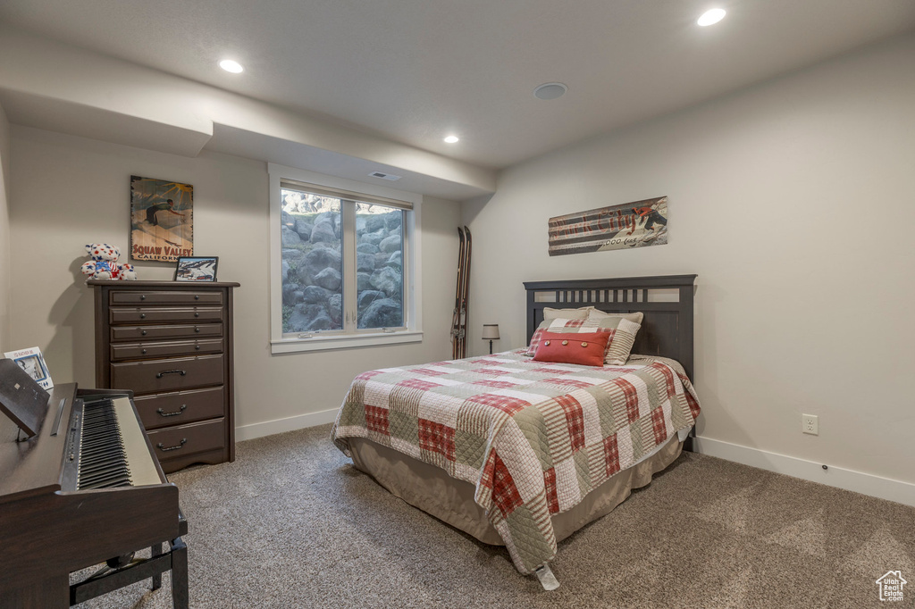 Bedroom with carpet floors, baseboards, and recessed lighting