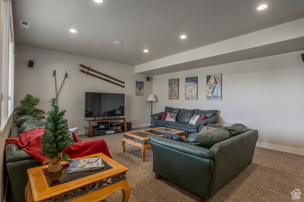 Living area featuring carpet, recessed lighting, and baseboards