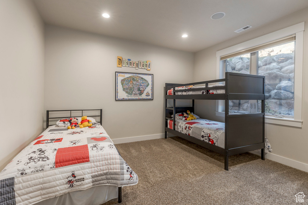 Bedroom with carpet, baseboards, and recessed lighting