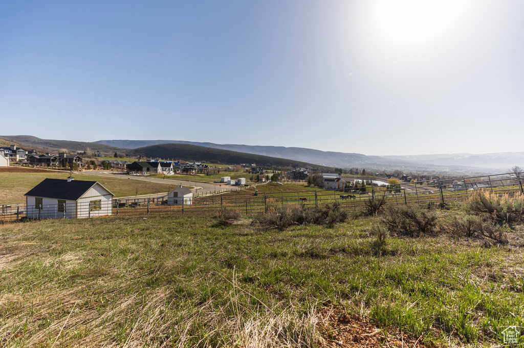 View of mountain backdrop with rural landscape