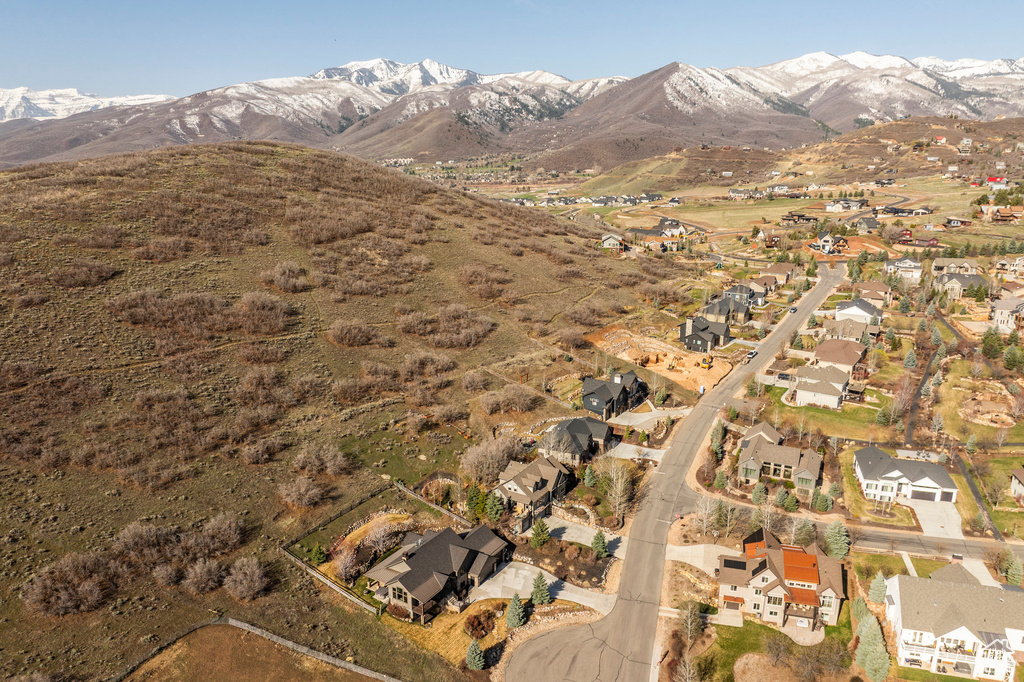 View of property location featuring nearby suburban area and a mountainous background