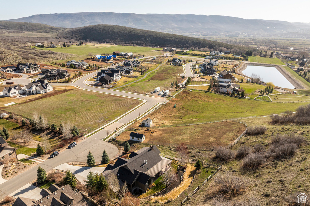Aerial view of property's location featuring a water and mountain view and rural landscape