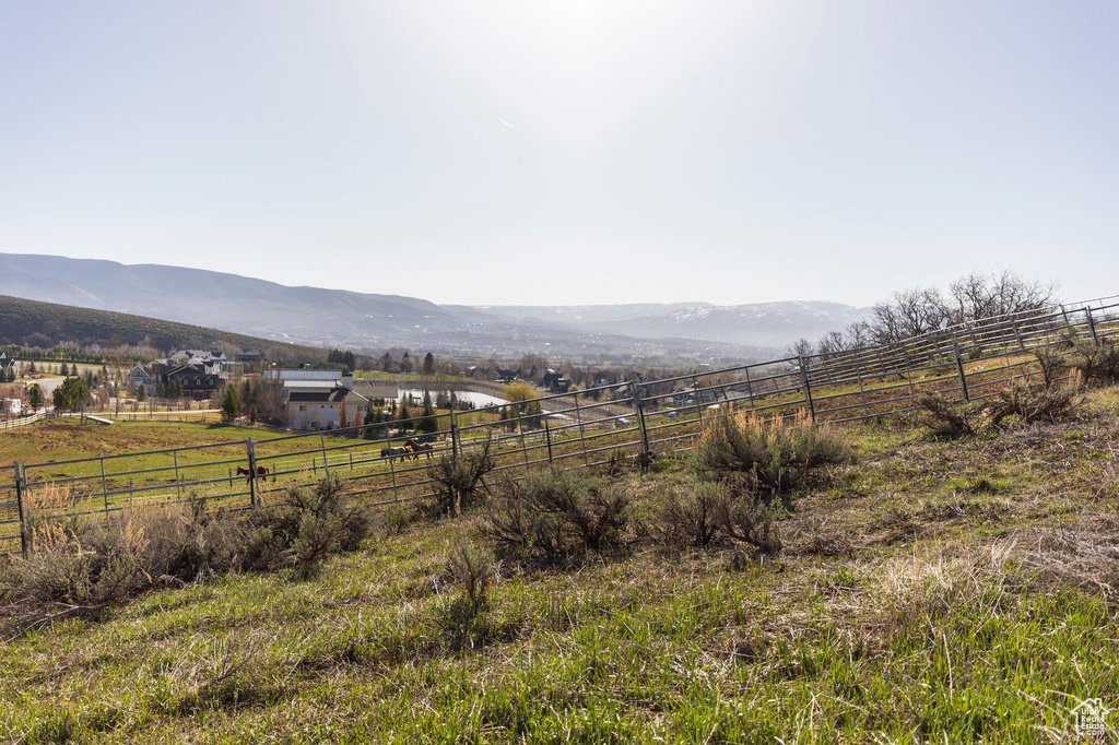 View of mountain backdrop featuring rural landscape