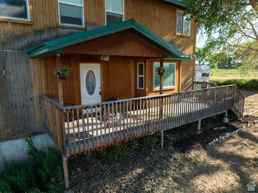 Doorway to property with a wooden deck