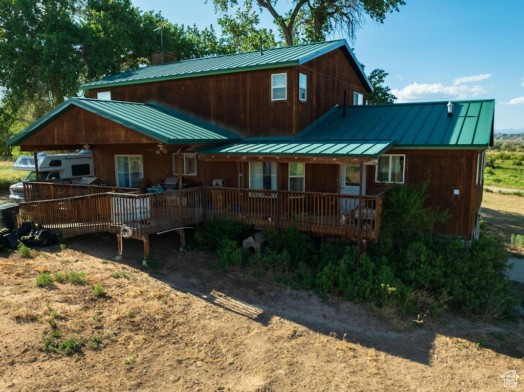 View of front of house with a standing seam roof and a metal roof