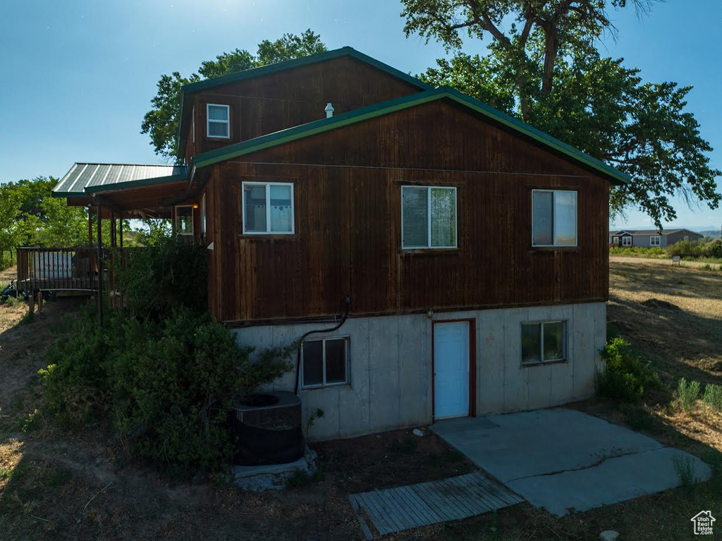 Back of house with a patio area